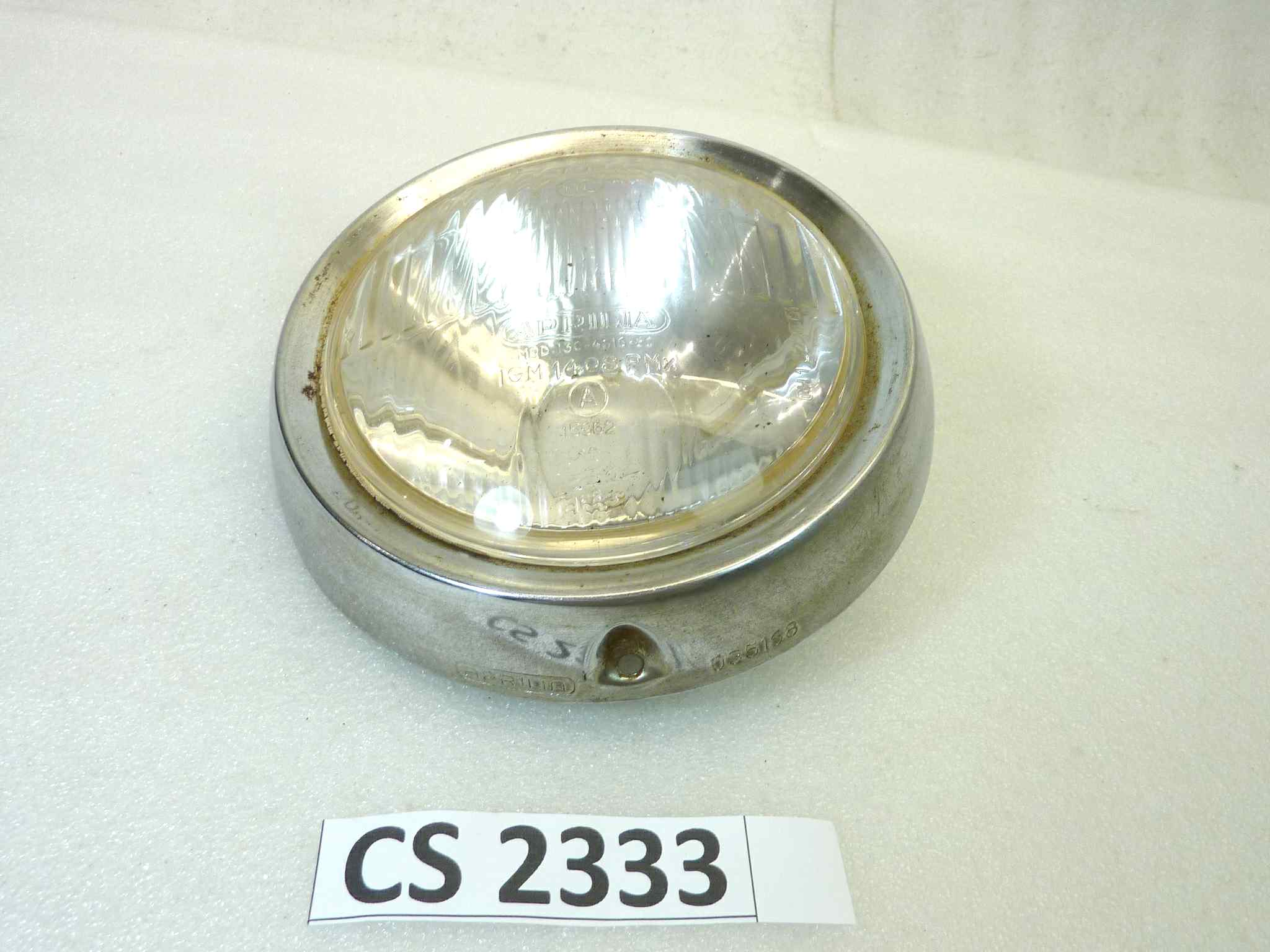 Gruppo ottico faro Aprilia mod 130461660 IGM 1408 PMX diam 130 mm Ghiera 035168 diam 170 mm